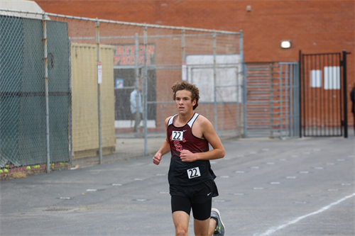Student running track